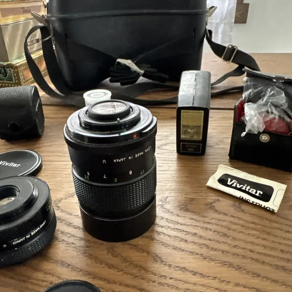vintage Vivitar hard-sided black camera case And Vivitar camera accessory lot